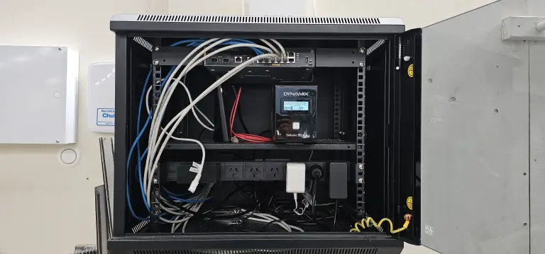 Server rack install with switch, UPS, and cable runs