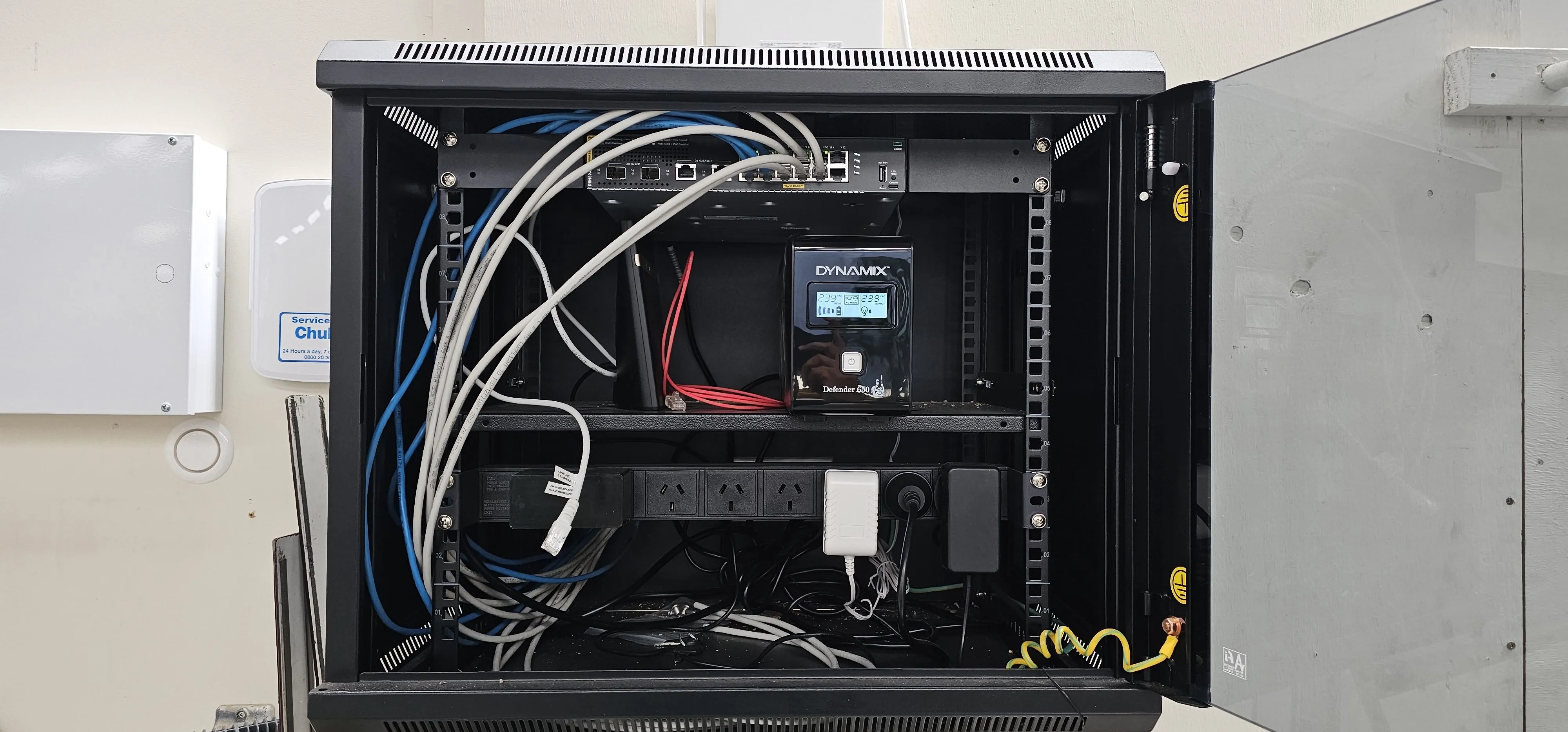 Server rack install with switch, UPS, and cable runs