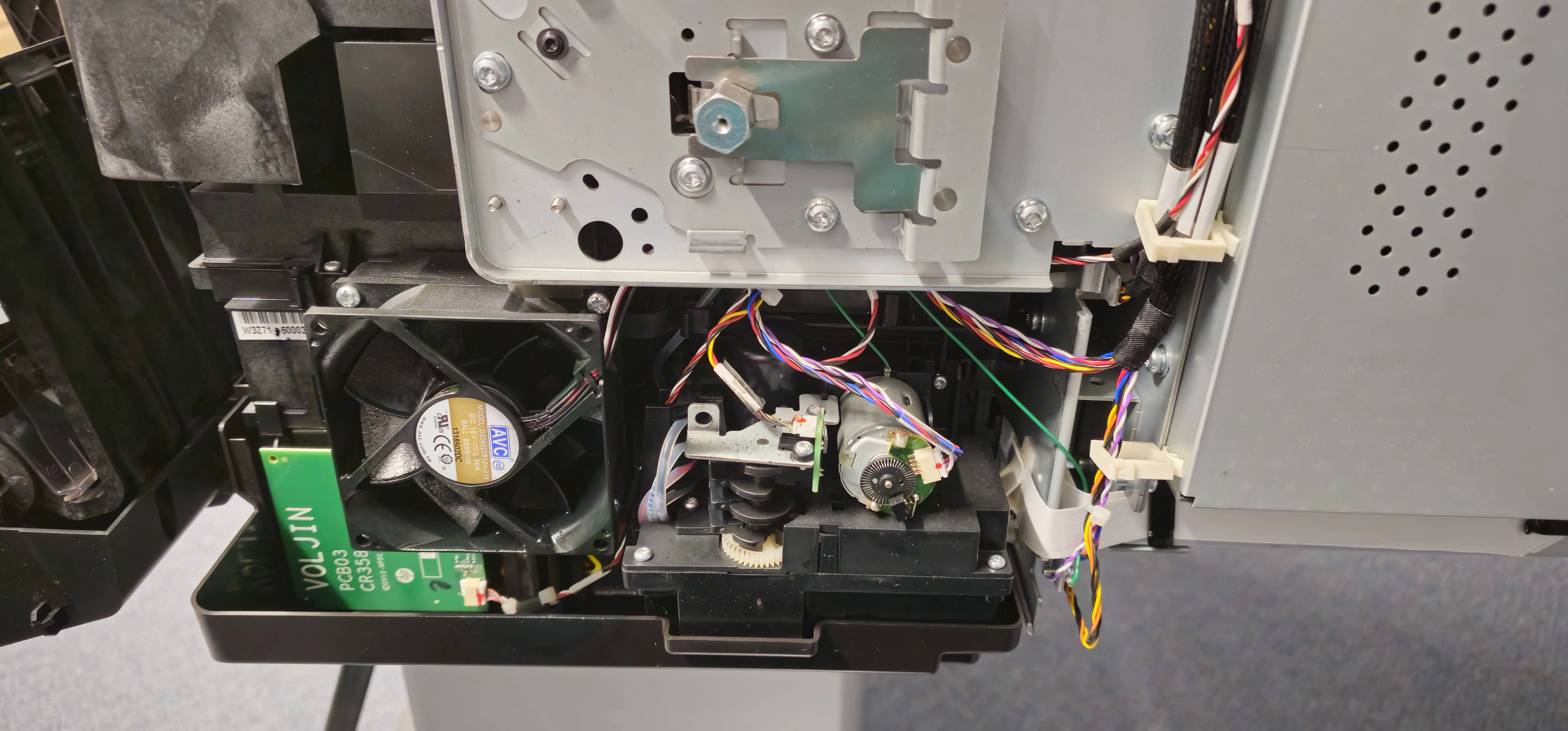 Close-up of printer fan, gears and motor assembly